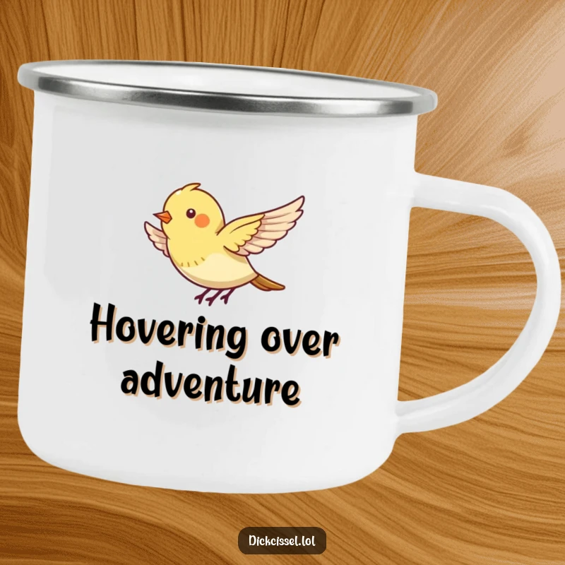 Funny camping mug features a tiny bird energetically flapping its wings, appearing to hover outdoors.