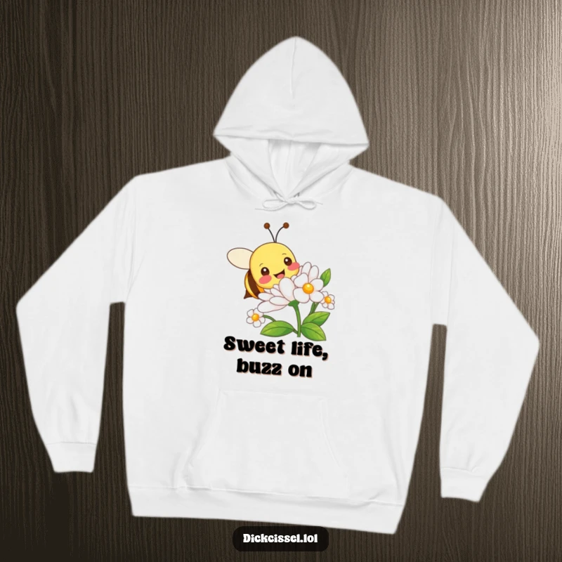 Funny hoodie featuring a happy bee character in motion, joyfully buzzing around a beautiful, detailed flower.