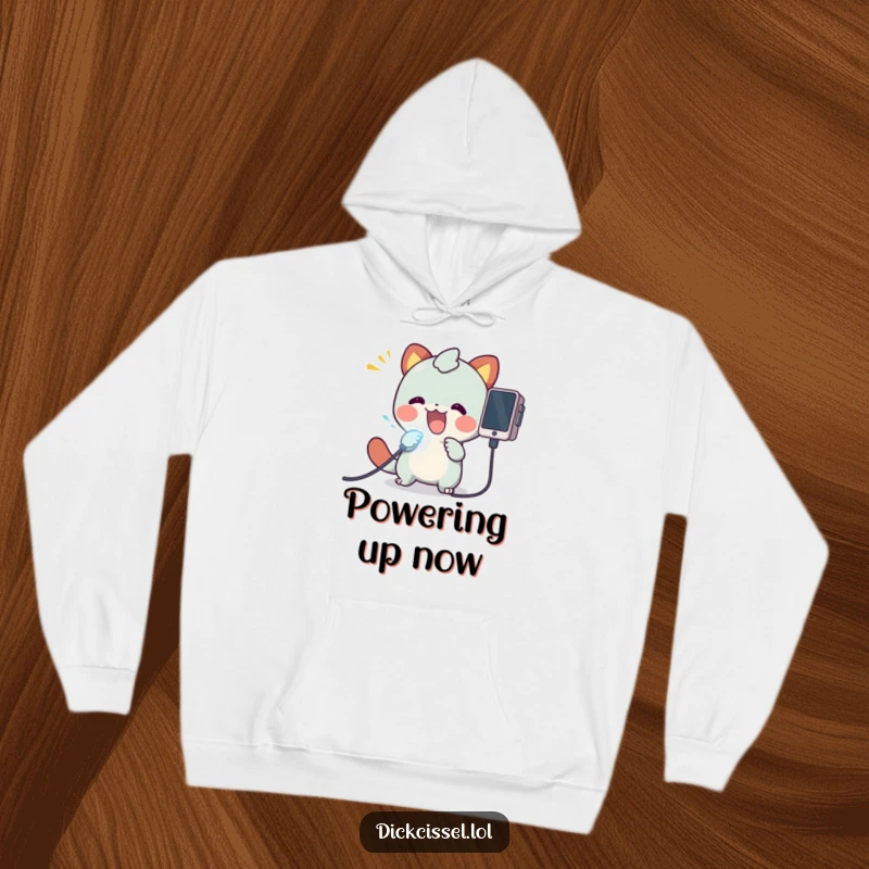 Funny hoodie depicting a creature with wide eyes plugging a luminous cable into an electronic device, radiating excitement and energy.